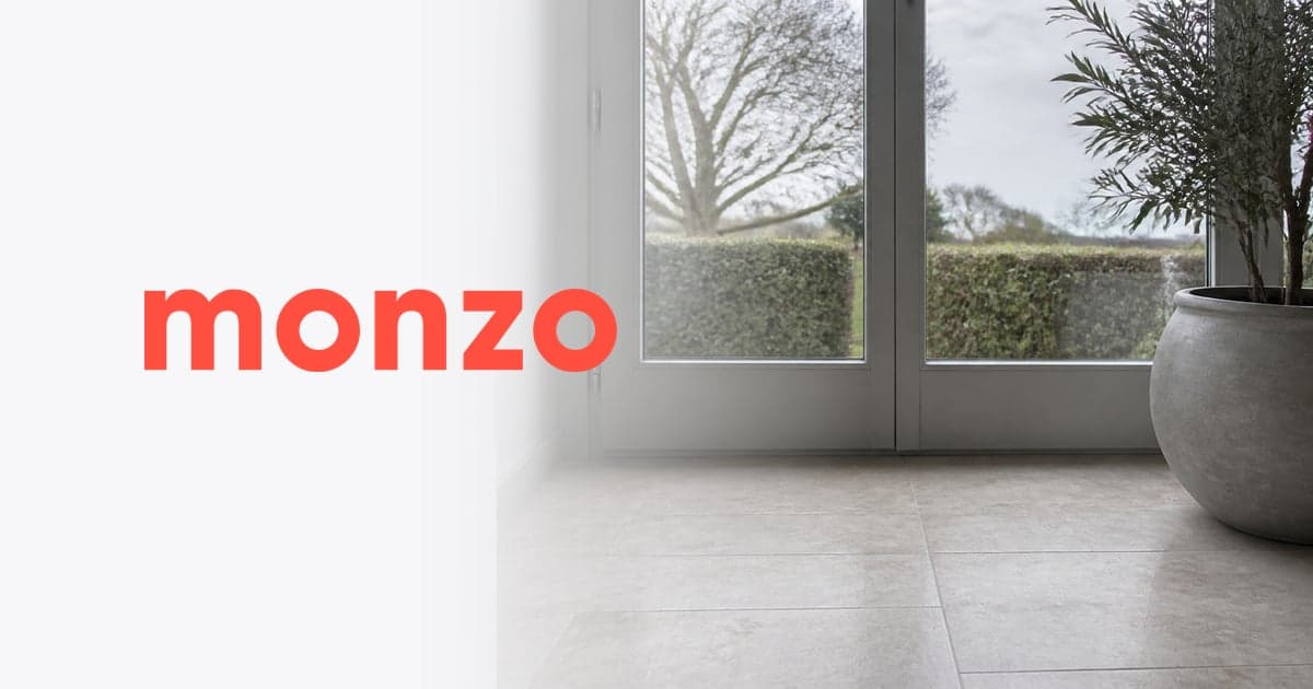 a bare tiled porch floor inside a glazed front door on a grey morning