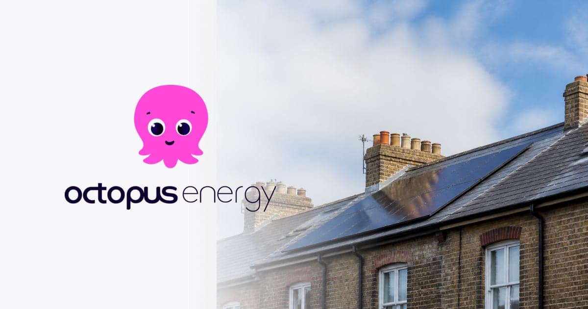 solar panels on the pitched slate roof of a terraced house against an open sky